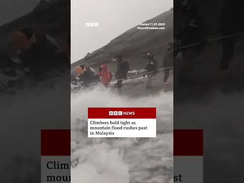 Climbers were forced to pass through fast-flowing water on Malaysia’s Mount Kinabalu. #BBCNews