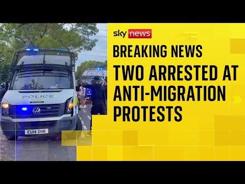 Two arrested after police officers are attacked at anti-migration protests in Essex