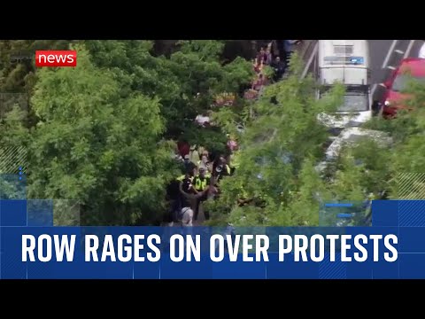 Row rages on over migrant protests