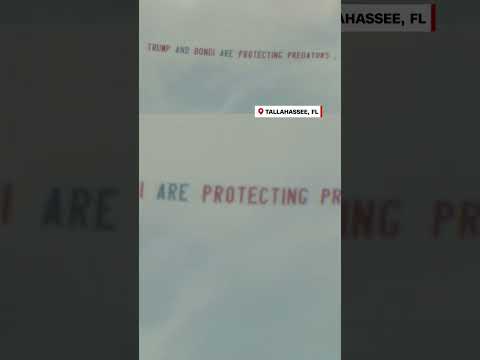 Protest banner flies over Epstein associate