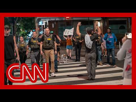 Crowd in DC outraged by federal law enforcement presence as cars stopped on busy street