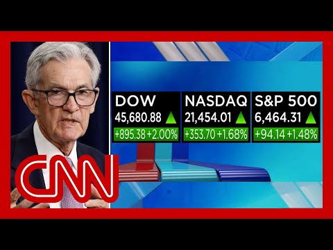 DOW soars into record territory as Powell hints at rate cut
