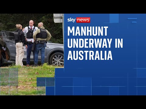 Manhunt after two police officers shot dead and third seriously injured in Australia