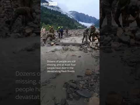 Man crawls through mud after flash floods in India