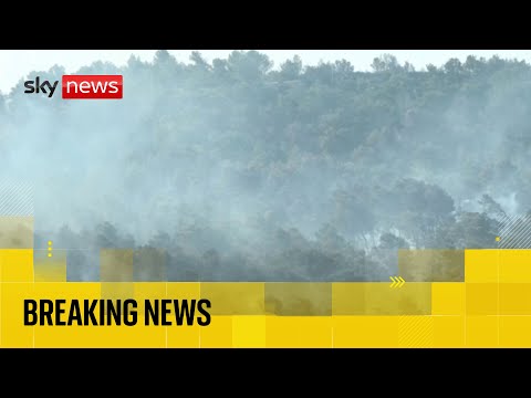 Wildfire burns in southern France forcing tourists and residents to flee
