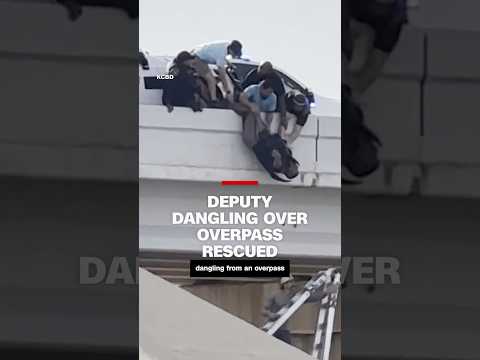 Deputy dangling over overpass rescued