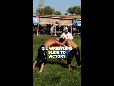 Watch: Oil wrestlers slide to victory