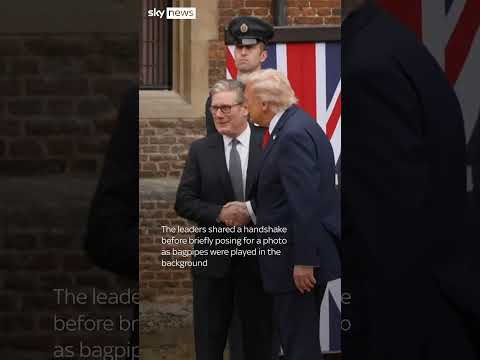 Trump waves as he arrives at Chequers