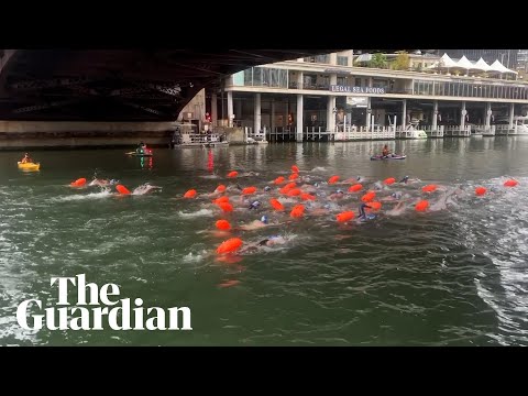 Moment hundreds of people plunge in Chicago River for first official swim in 100 years