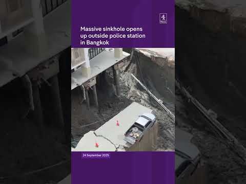 Massive sinkhole opens up outside police station in Bangkok