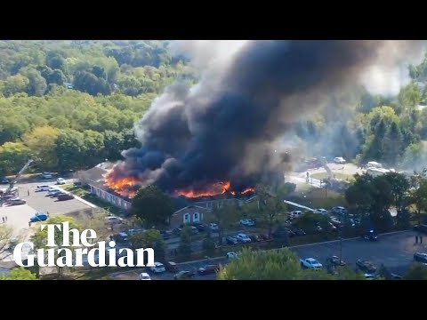 Drone footage shows church on fire after shooting in Michigan