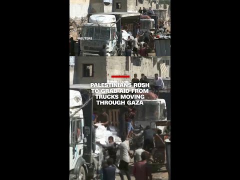 Palestinians rush to grab aid from trucks moving through Gaza