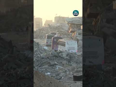 Red Cross buses drive through destroyed buildings in Khan Younis in southern Gaza #shorts