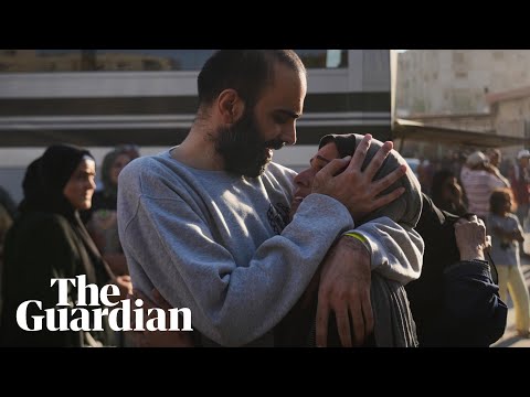 Freed Palestinian prisoners embrace loved ones after being released to Gaza