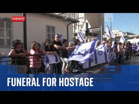 Crowds line the streets for funeral procession of hostage returned by Hamas
