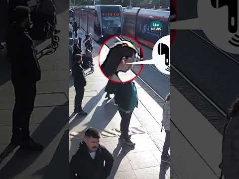 Near-miss as security guard saves woman from walking in front of tram #itvnews
