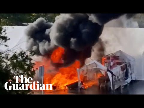 Protesters’ tents on fire after shots reportedly fired outside Serbian parliament