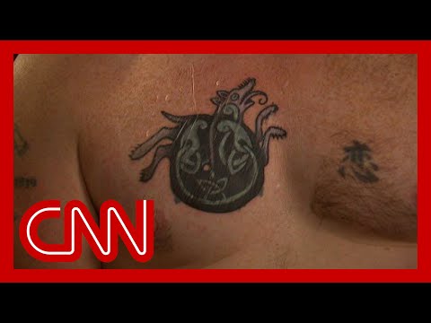 Democratic Senate candidate says he covered up tattoo once linked to Nazi symbol