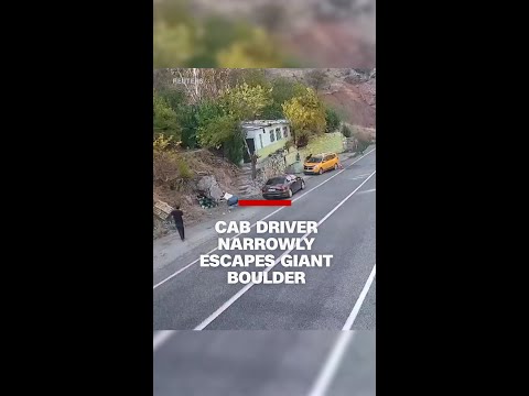 Cab driver narrowly escapes giant boulder