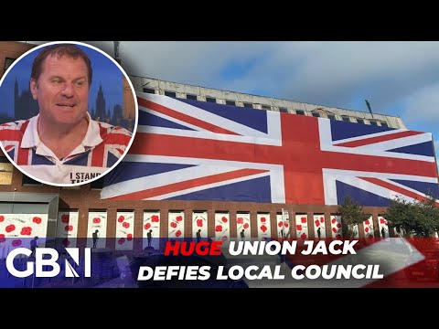 HUGE Union Jack hung up on an ex council building, defying the local authority