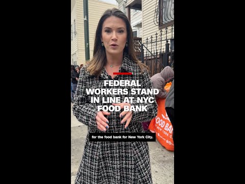 Federal workers stand in line at a NYC food bank