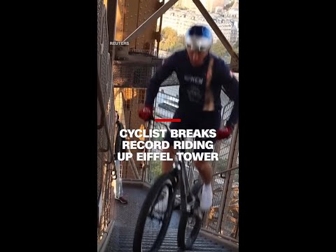 Cyclist breaks record riding up Eiffel Tower