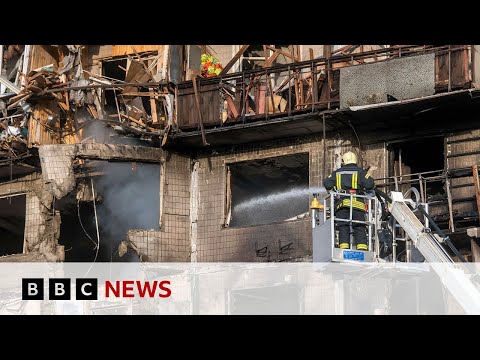 Russian drone slams into block of flats in deadly wave of strikes across Kyiv | BBC News