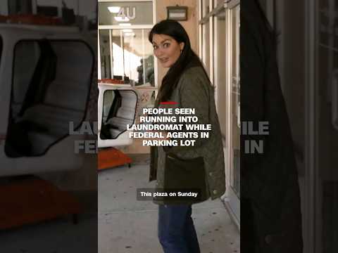 People seen running into laundromat while federal agents in parking lot