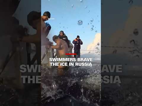 Swimmers brave the ice in Russia