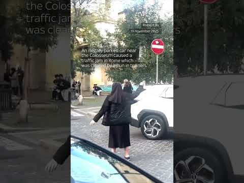 Nun directs traffic near Colosseum