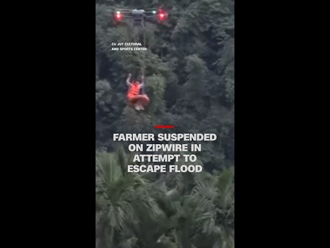Farmer suspended on zipwire in attempt to escape flood