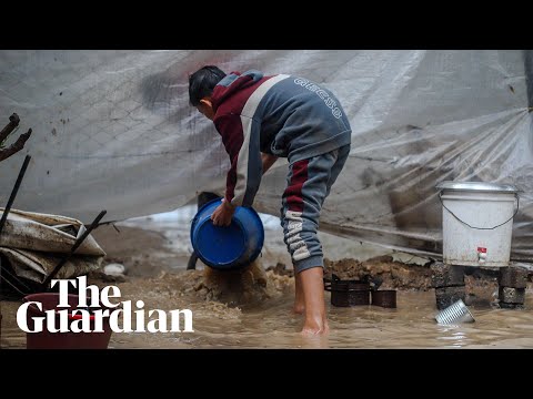 ‘We are getting sick’: heavy rainstorms flood tent camps in Gaza