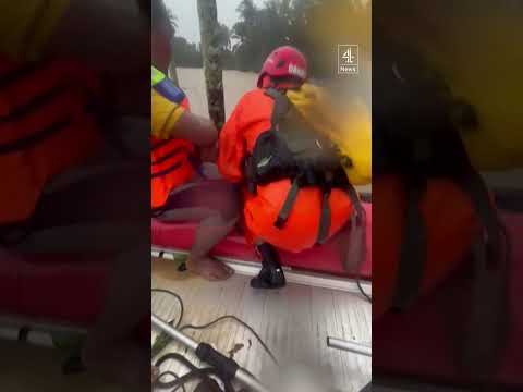 Two men clinging to trees rescued in deadly Indonesia floods