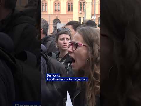 Serbians march in anniversary rally for deadly train station collapse | DW News