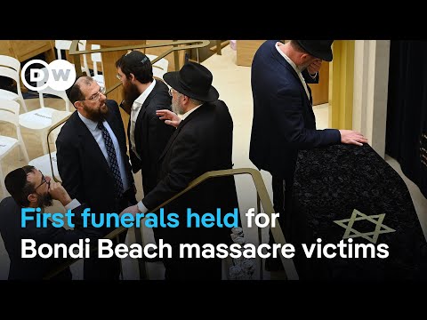 Suspect charged as first Bondi Beach attack victim buried | DW News