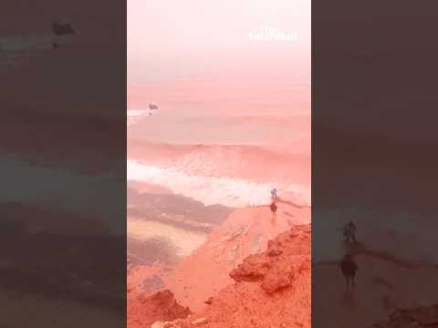 Rain transforms Iranian beach into striking red spectacle