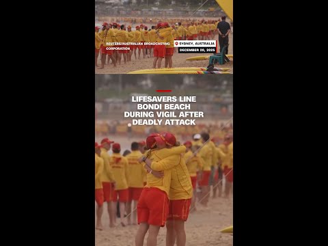 Lifesavers line Bondi Beach during vigil after deadly attack