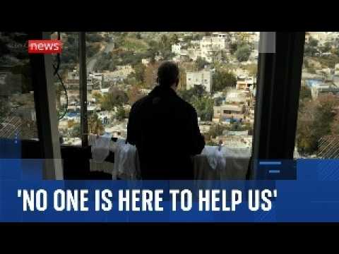 Palestinians watch as Israeli diggers tear down homes in East Jerusalem