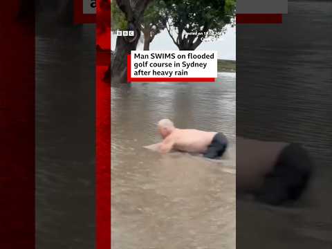 Man swims on flooded golf course in Sydney after heavy rain. #Australia #BBCNews