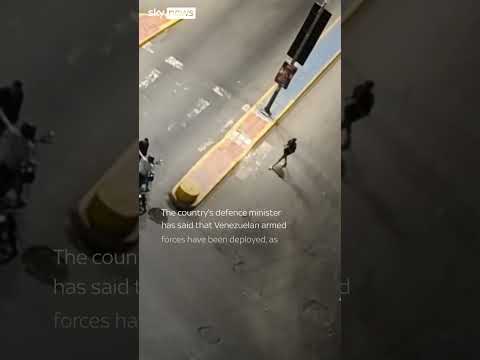 Armed men and tank seen on streets of Venezuela