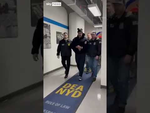 Nicolas Maduro escorted by agents in handcuffs after landing on US soil