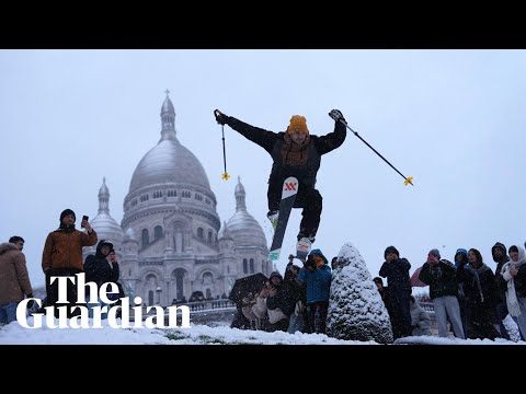 Parisians ski and sled down snowy Montmartre slope