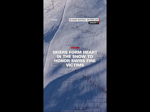 Skiers form heart in the snow to honor Swiss fire victims