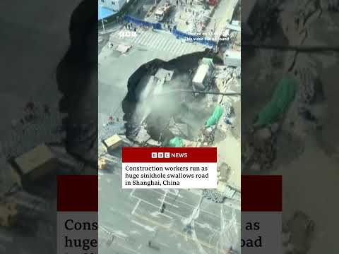Construction workers run as huge sinkhole swallows road in Shanghai, China. #BBCNews