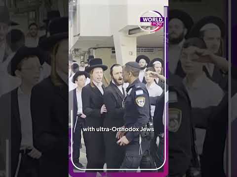 Ultra-Orthodox men chase Israeli soldiers