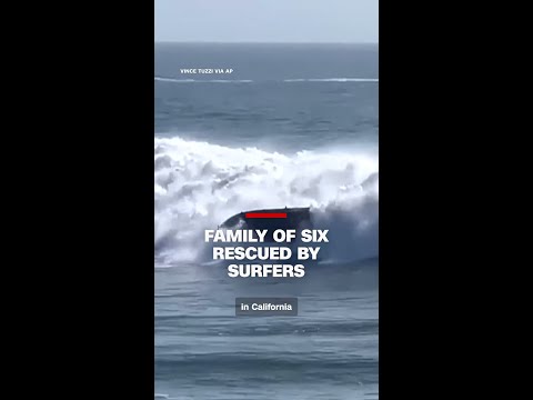Surfers rescue family of six after boat capsizes