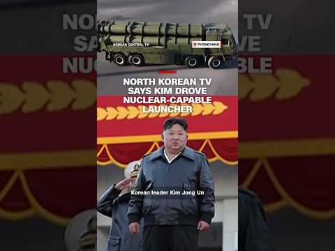 North Korean TV says Kim drove nuclear-capable launcher