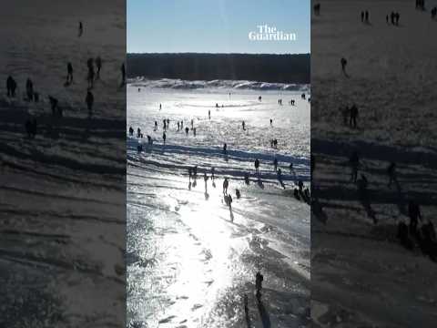 People gather on frozen Baltic Sea in Poland