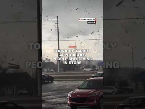 Tornado rapidly approaches people sheltering in store