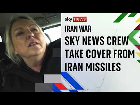 Drivers abandon vehicles and take shelter as air raid sirens ring out in Israel